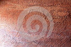 Beautiful color texture pink orange red yellow white color geological rock formations in city of Petra in Jordan