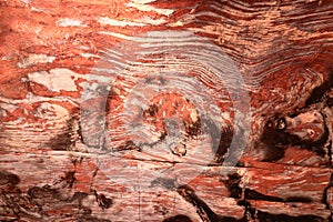 Beautiful color texture pink orange red yellow white color geological rock formations in city of Petra in Jordan