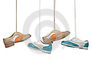 Beautiful color woman shoes hanging on laces with isolated white