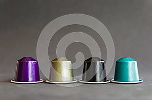 Beautiful colored coffee capsules on black background