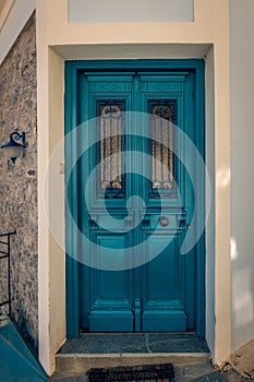 Beautiful colored door entrance into a picturesque house in the