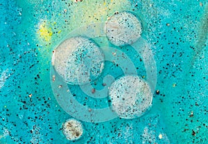 Beautiful colorful background with glitter and colored bubbles in oil and watercolor. Sparkle particles. Macro oil ink bubbles and