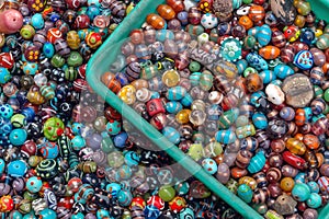 Beautiful colorful ceramic and glass Indian jewelry beads at a roadside market during my travels to Varanasi, India