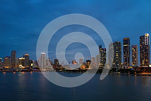 Beautiful colorful city of Miami Florida skyline and bay with night clouds. Miami skyline on Biscayne Bay, city night