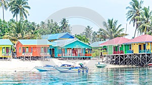 Beautiful and colorful cottages at Derawan Island Resort,