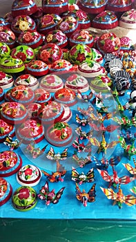 Beautiful and colorful crafty cocos and car stances sold in Quetzala, Guerrero, Mexico photo