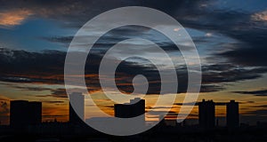 Beautiful colorful dramatic sunset sky over silhouette