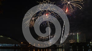 Beautiful colorful holiday fireworks on the black sky background, long exposure. Festive concept