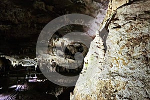 Beautiful colorful and illuminated cave with stalactites and stalagmites