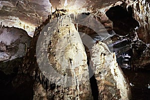 Beautiful colorful and illuminated cave with stalactites and stalagmites