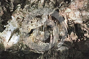 Beautiful colorful and illuminated cave with stalactites and stalagmites