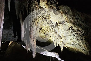 Beautiful colorful and illuminated cave with stalactites and stalagmites