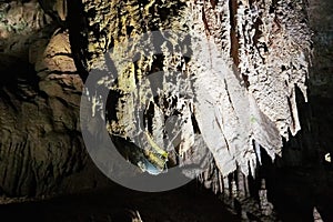 Beautiful colorful and illuminated cave with stalactites and stalagmites