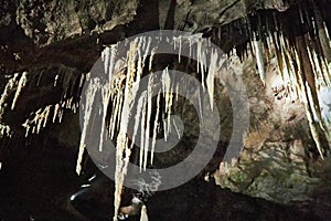 Beautiful colorful and illuminated cave with stalactites and stalagmites