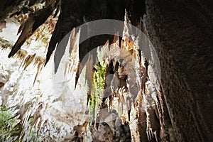 Beautiful colorful and illuminated cave with stalactites and stalagmites