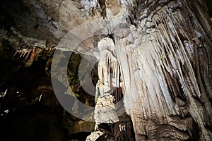 Beautiful colorful and illuminated cave with stalactites and stalagmites