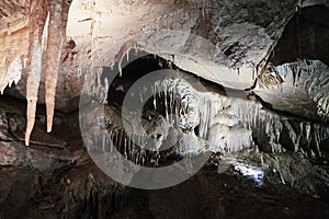 Beautiful colorful and illuminated cave with stalactites and stalagmites