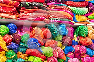 Beautiful colorful Indian sarees, displayed for sale at market place, Jaisalmer, India