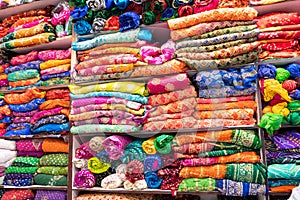 Beautiful colorful Indian sarees, displayed for sale at market place, Jaisalmer, India