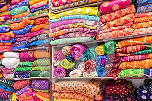 Beautiful colorful Indian sarees, displayed for sale at market place, Jaisalmer, India