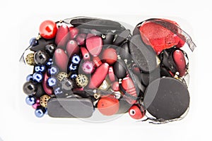 Beautiful colorful jewelry making beeds on white background. Shallow depth of field. photo