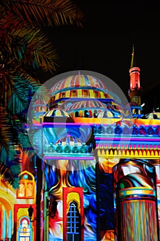 Beautiful colorful lights with Middle Eastern patterns and drawings displayed on a mosque - Sharjah lights festival