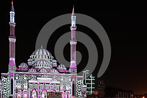 Beautiful colorful lights with Middle Eastern patterns and drawings displayed on a mosque - Sharjah lights festival