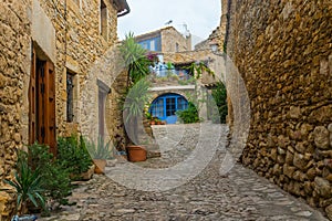 Beautiful colorful medieval street and terrace with plants