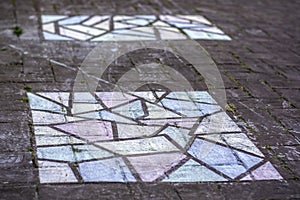 A beautiful colorful mosaic chalk drawing on sidewalk