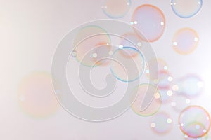 Beautiful colorful pink soap bubbles float background.