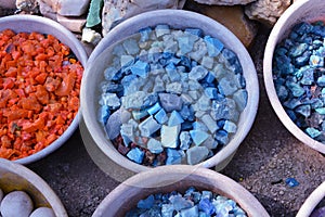 Beautiful colorful stones in clay vessels close up for background