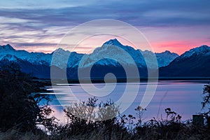 Beautiful colorful sunrise over glacial Lake Pukaki and Mount Cook from near Twizel, winter