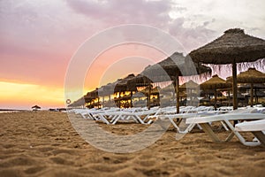 Beautiful colorful sunset on the beach in Vilamoura, Algarve, Portugal photo