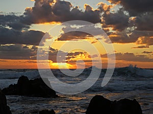 Beautiful Colorful Sunset Dawn Over Sea Waves Hitting Rocky Stone Beach