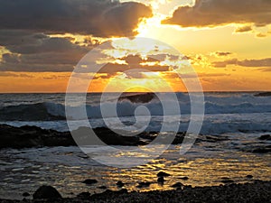 Beautiful Colorful Sunset Dawn Over Sea Waves Hitting Rocky Stone Beach