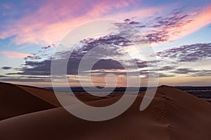 Beautiful colorful sunset in Erg Chebbi Dunes, Sahara Desert, Merzouga, Morocco