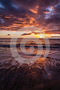 Beautiful Colorful Sunset Over Beach with Clouds