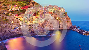 Beautiful colorful view of village Manarola by night in Cinque Terre, Italy
