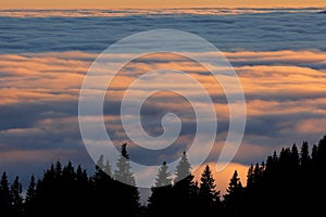 Beautiful and colorfull thermal inversion phenomenon photographed in mountains at high altitude at sunset