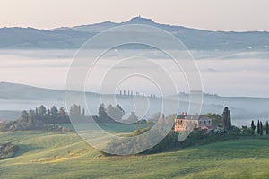 Beautiful colors of green spring panorama landscape of Tuscany. Most popular place in Italy. Green fields and blue sky and Cypress