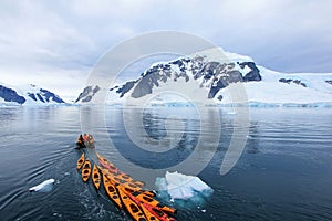Beautiful colourful kayaks on the blue ocean, Antarctic Peninsula
