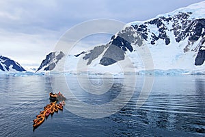 Beautiful colourful kayaks on the blue ocean, Antarctic Peninsula