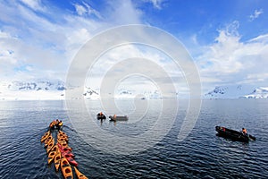 Beautiful colourful kayaks on the blue ocean, Antarctic Peninsula