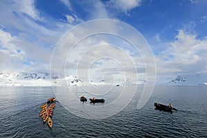 Beautiful colourful kayaks on the blue ocean, Antarctic Peninsula