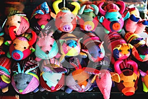 beautiful and colourful silk and cotton Indian craft toys of animals handmade sold in souvenir shop market stall