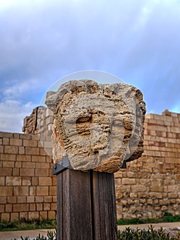 Beautiful Column capital representing a lion head original from Roman times in Cesarea Israel