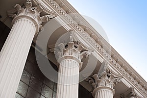 Beautiful columns of the capital on the facade of the historic building