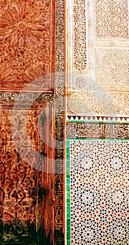 A beautiful combination, a wood carving door, a carving wall with a beautiful pattern Tile. Fes - Marroco.