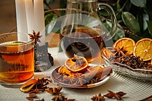 Beautiful composition with anise, cloves, cinnamon stick and powder, tea and dried orange