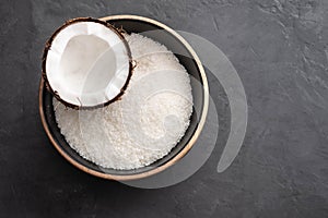 Beautiful composition with coconuts on black background. Copy space.